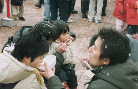 Families eating a pot cooking